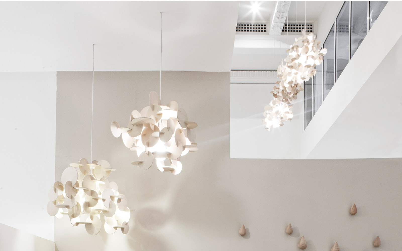 Bau Lamp | A sculptural wooden ceiling lamp of multicolored elements